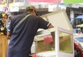 A cake seller serving consumers at a traditional market