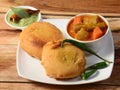 Batata Vada or Potato Fritter is a popular snack in Maharashtra,India. mashed potato patty coated with chick pea flour, which is