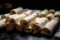 a batch of homemade burritos, ready to be packed for lunches or dinners