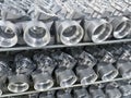 batch of machined die cast aluminum parts placed on a rack, automotive parts mass production, CNC machining, mass production of Royalty Free Stock Photo