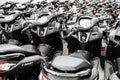 A batch of new Motorbikes parked at a dealership lot.