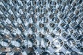 A batch of shiny metal cnc aerospace parts production - close-up with selective focus for industrial background