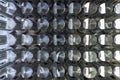 Batch of shiny metal parts after cnc turning and milling top-down view with selective focus.