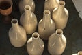 Batch of traditional handmade bottle design from raw ceramic material Royalty Free Stock Photo