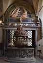 Batesimal stone source with sculptures in low relief in the basilica of San Frediano in Lucca.