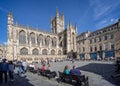 Bath Abbey and Kingston Parade with busker performing in Bath, Avon, U