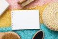 Bath accessories and blank notepad over colored Royalty Free Stock Photo