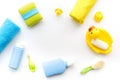 Bath accessories for kids. Yellow rubber duck, soap, sponge, brushes, towel on white background top view copyspace Royalty Free Stock Photo