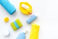 Bath accessories for kids. Yellow rubber duck, soap, sponge, brushes, towel on white background top view copyspace Royalty Free Stock Photo