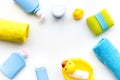 Bath accessories for kids. Yellow rubber duck, soap, sponge, brushes, towel on white background top view copyspace Royalty Free Stock Photo