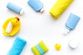 Bath accessories for kids. Yellow rubber duck, soap, sponge, brushes, towel on white background top view copyspace Royalty Free Stock Photo