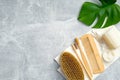 Bath accessories and natural SPA beauty products with green leaf on stone background. Personal hygiene and body treatment concept Royalty Free Stock Photo