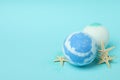 Bath balls and starfishes on blue background Royalty Free Stock Photo