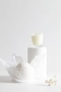 bath bomb and candle on podium on white background. Still life for wall decoration in resort spa or salon.