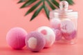 Bath bomb, pink body salt, colorful sweet balls, sizzling bubbles, fragrant cosmetics Royalty Free Stock Photo