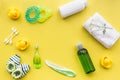 Bath cosmetic set for kids, towel and toys yellow background top view space for text Royalty Free Stock Photo