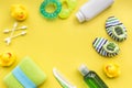 Bath cosmetic set for kids, towel and toys yellow background top view space for text Royalty Free Stock Photo