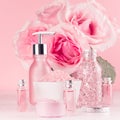 Bath cosmetics products, romantic bouquet, accessories in elegant pastel pink color - massage rose oil, bath salt, cream, soap. Royalty Free Stock Photo