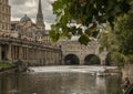 Bath, England - the Avon river/the Pulteney Bridge and a fishing man.