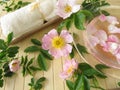 Bath essence with wild rose flowers Royalty Free Stock Photo