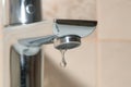 Bath faucet and falling water drop Royalty Free Stock Photo