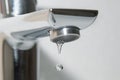 Bath faucet and falling water drops Royalty Free Stock Photo