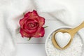 Bath fizzer in heart shape and red rose Royalty Free Stock Photo
