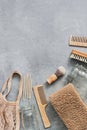 Bath and home accessories. Cotton bag, glass jar, wooden comb, wooden shaving brush, cuticle pusher, brush, loofah washcloth on a