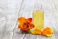 Bath oil and orange rose Royalty Free Stock Photo