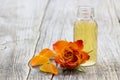 Bath oil and orange rose Royalty Free Stock Photo