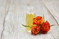 Bath oil and orange roses Royalty Free Stock Photo