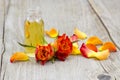 Bath oil and orange roses Royalty Free Stock Photo