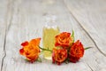 Bath oil and orange roses Royalty Free Stock Photo