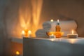 bath oils on plinth, candles flickering slightly blurred Royalty Free Stock Photo