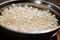 bath pearls spread elegantly around an empty tub Royalty Free Stock Photo