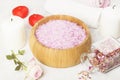Bath salt with aroma of a rose in a wooden bowl, petals Royalty Free Stock Photo