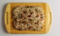 Bath salt with dried lavender and rose flowers. Salt background for spa treatments. Salt on a wooden board on a white background