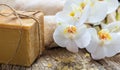Bath salt, orchid and soap on a wooden background