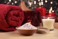 Bath salt, red towel and candle on wooden background spa still life stock photo images Royalty Free Stock Photo