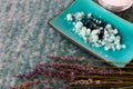 Blue bath salts and lavender flowers Royalty Free Stock Photo