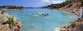 Bath in the sea with tourists and vacationers at the thermal healing hot springs of the Greek resort of Methana on the Peloponnese