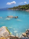 Bath in the sea with tourists and vacationers at the thermal healing hot springs of the Greek resort of Methana on the Peloponnese