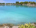 Bath in the sea with tourists and vacationers at the thermal healing hot springs of the Greek resort of Methana on the Peloponnese