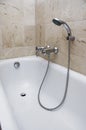 Bath with shower attachment