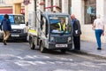 Bath Somerset May 23rd 2019 a goupil electric utility vehicle with a ranger sat talking to a man with a clipboard