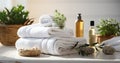 Bath towels with beauty treatment products setting in spa center in white room, Royalty Free Stock Photo