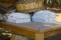 Bath towels and blanket of different colors in wicker basket Royalty Free Stock Photo