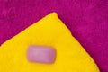 Bath towels in bright colors and lilac soap, flat lay. Horizontal photo with copy space Royalty Free Stock Photo