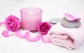 Bath towels, candle and soap with pink roses Royalty Free Stock Photo