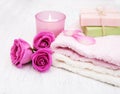 Bath towels, candle and soap with pink roses Royalty Free Stock Photo